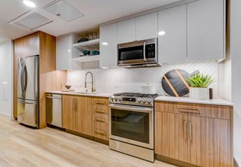 Chef inspired kitchens featuring expansive quartz countertops and center islands